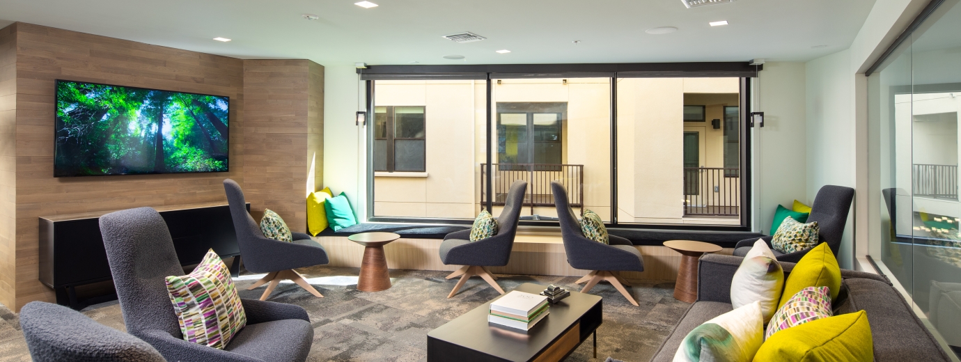 Club loft with lounge chairs and a big tv