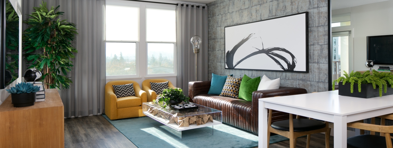 Living room with brown couch and yellow sofas