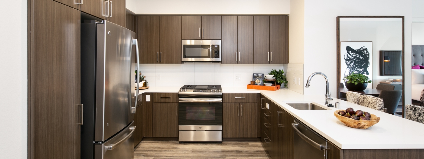 Brown kitchen with a bowl of figs